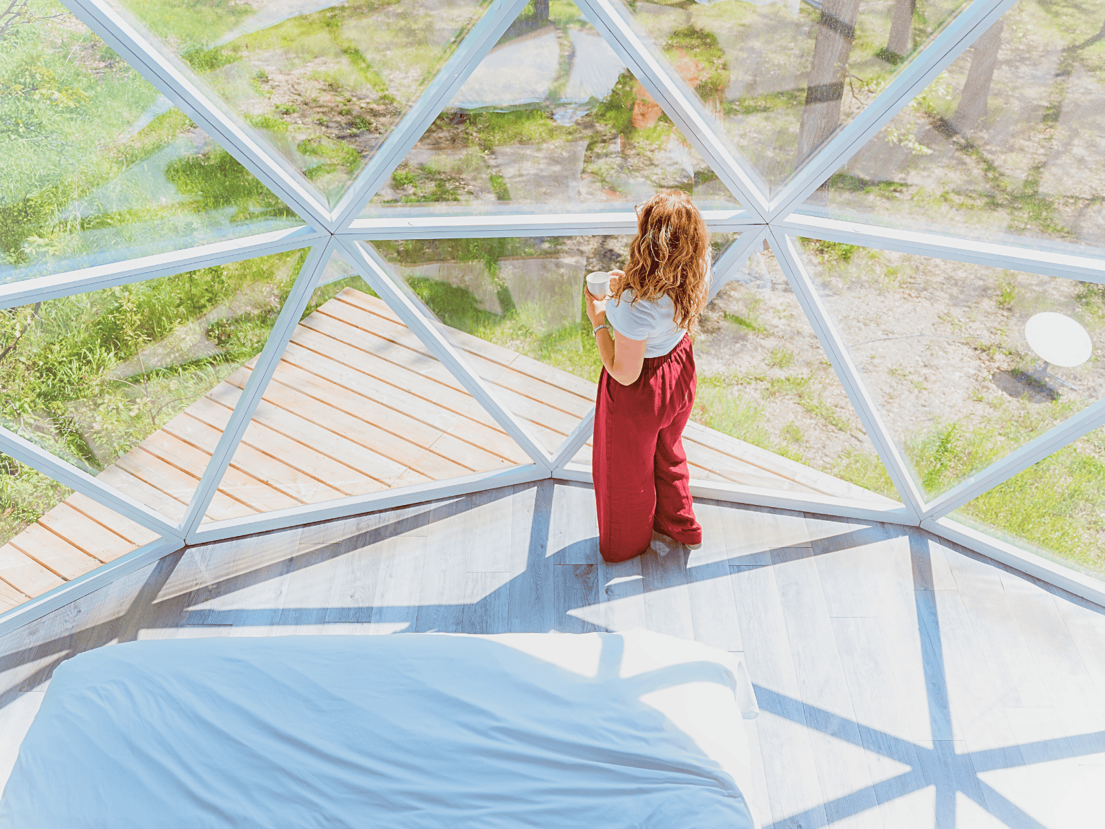 a woman standing in front of a hybrid panorama window