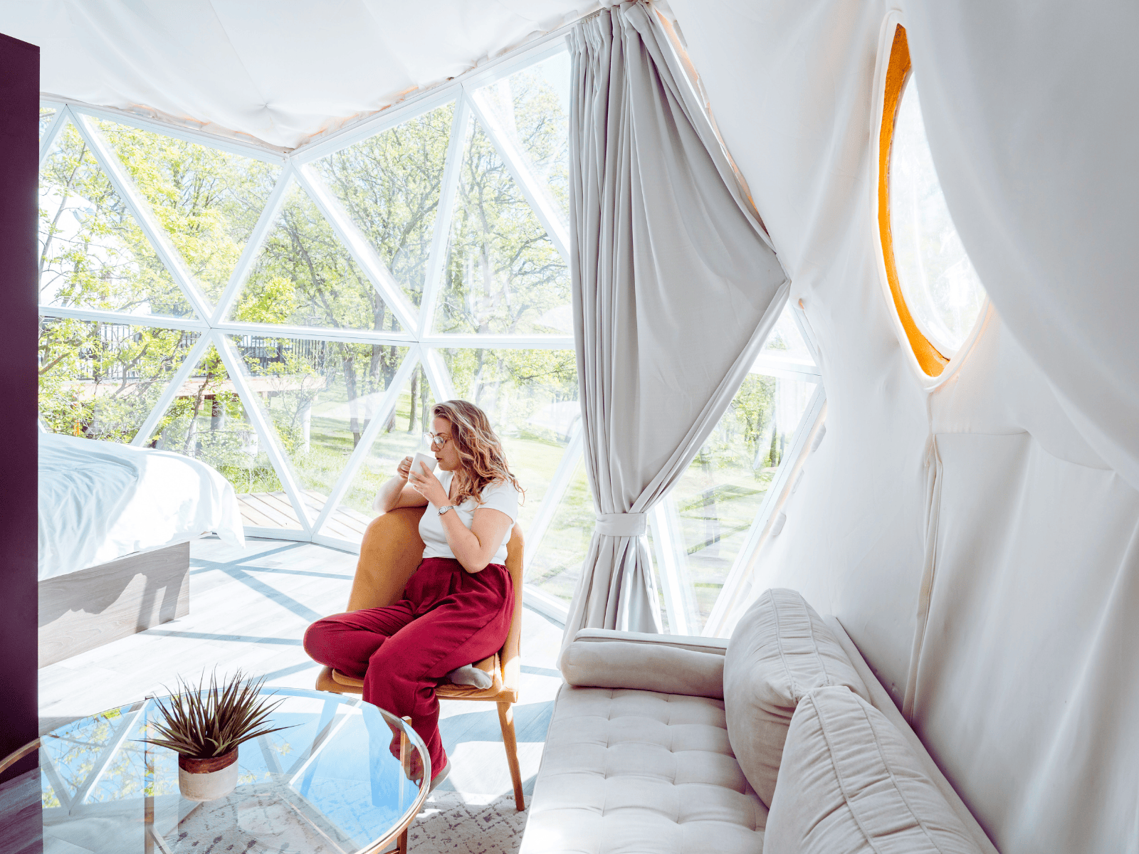 a woman sipping coffee on a geodesic bedroom