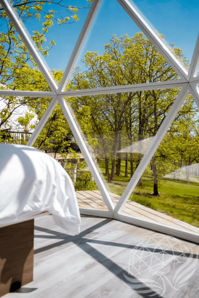 a bedroom with hybrid panorama window