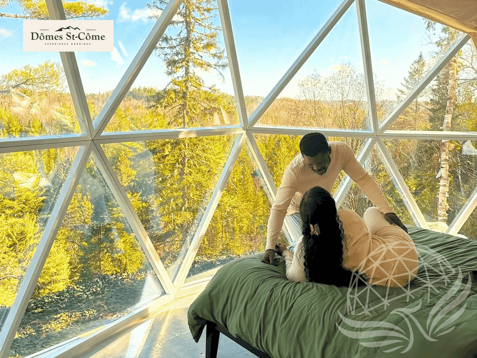 a couple enjoying a stay inside a geodesic dome with hybrid panorama window