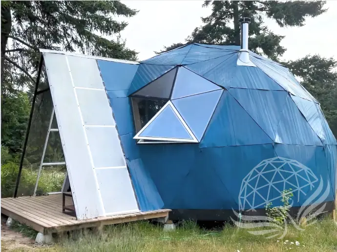 A residential dome with blue aluminum cover , a hexagon window and A Frame door awning