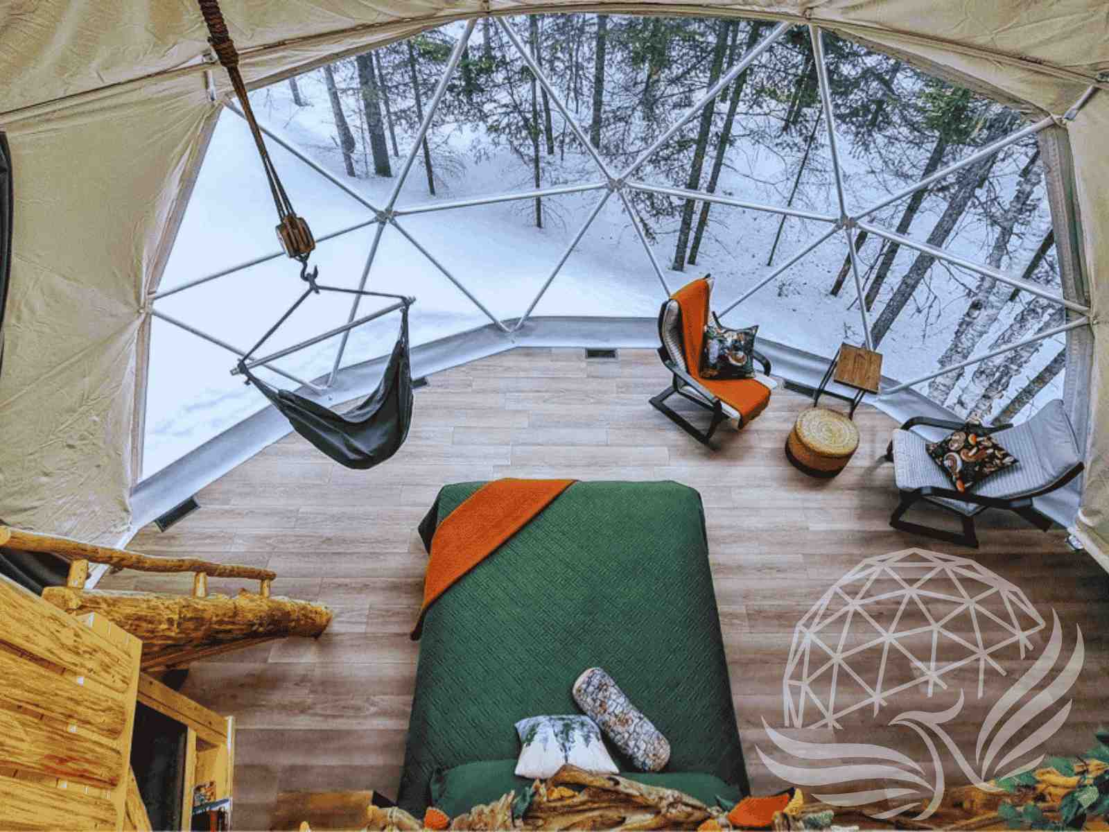 Winter dome bedroom with panoramic window and forest snow view