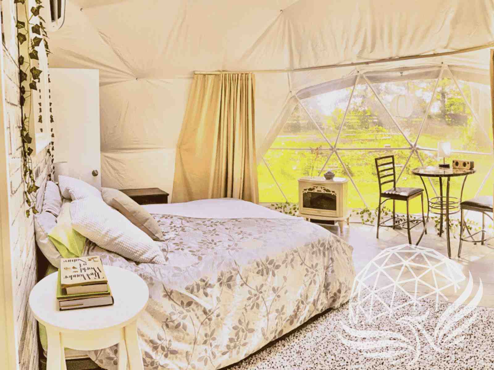 	Sunlit dome bedroom with floral linens and elegant garden view