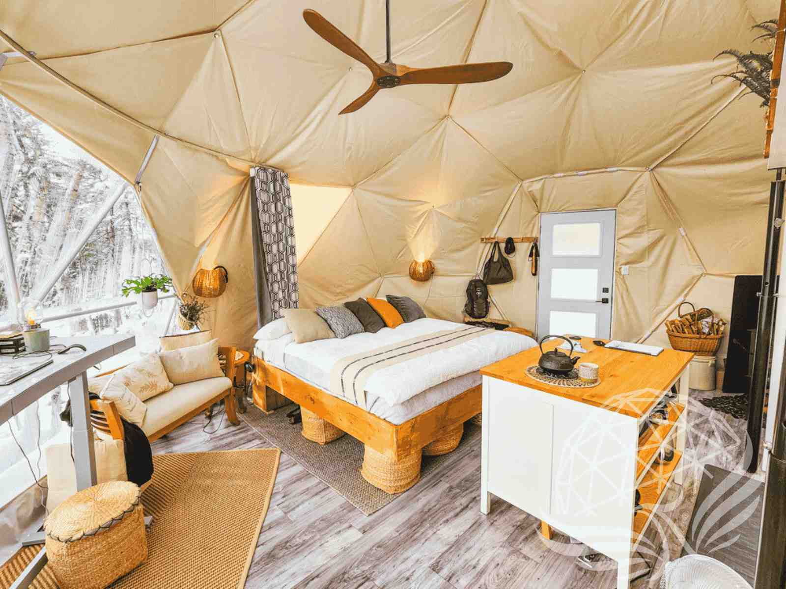 Warm winter dome retreat with rustic furniture and nature view