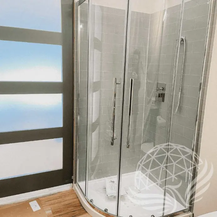 Modern bathroom with glass shower inside Moonshine Dome Retreat
