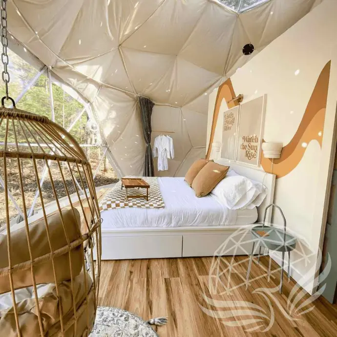 Bright dome bedroom with panoramic window at Moonshine Dome Retreat