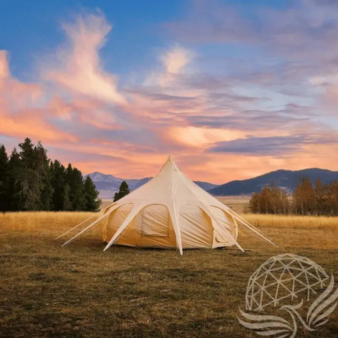Luxury Lotus Glamping Tent | Phoenix Domes Cream-colored Lotus tent in a scenic mountain meadow at sunset, ideal for luxury glamping.