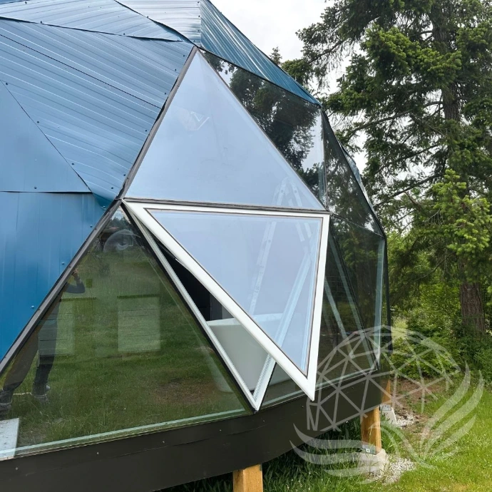 A blue geodesic dome with Glass panorama window with openers