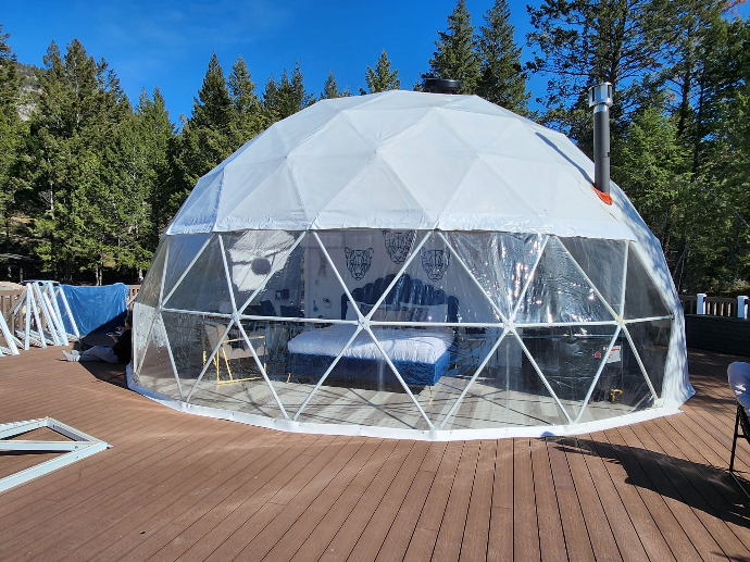 White geodesic domes with glass panorama window