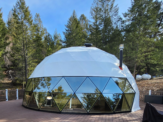 White geodesic domes with glass panorama window