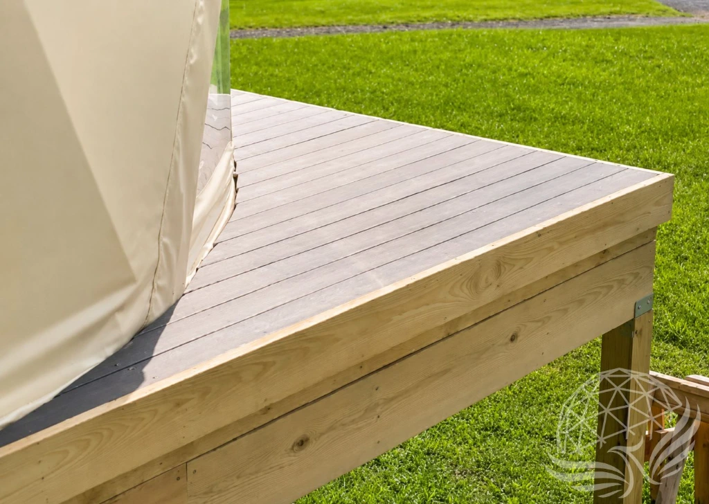 Sunlit Wooden Deck by the Lawn