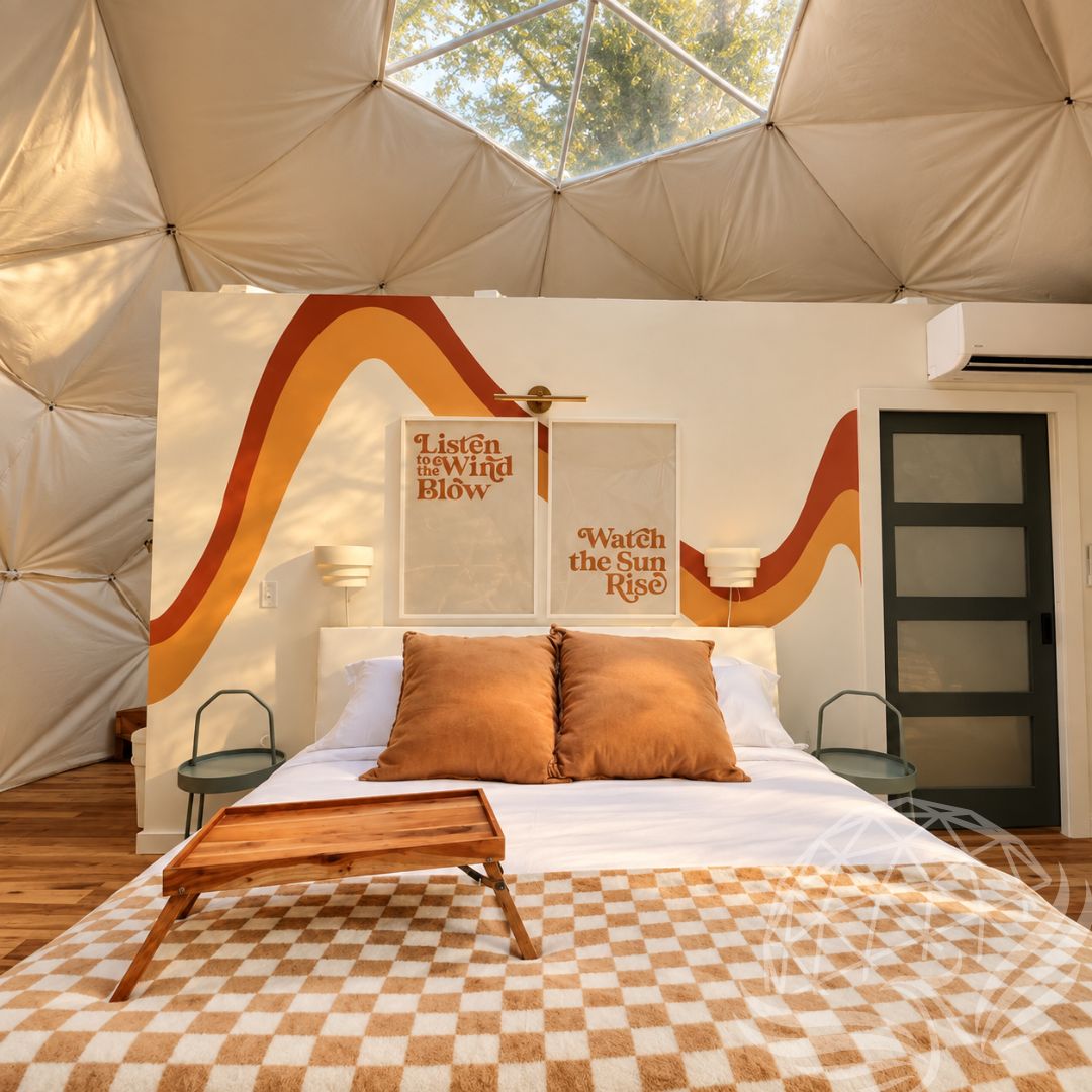 Cozy bedroom with retro wall design inside Moonshine Dome Retreat